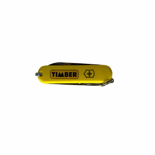 Canivete fechado na cor amarela com o logotipo "TIMBER" e o símbolo da Suíça destacado, exibindo um design compacto e funcional.